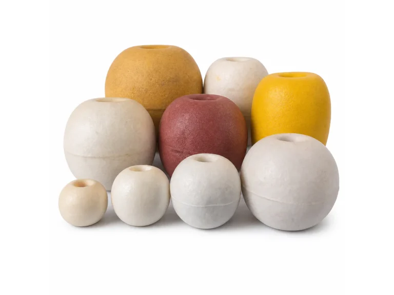 Fishing net floats in multiple sizes on a white background