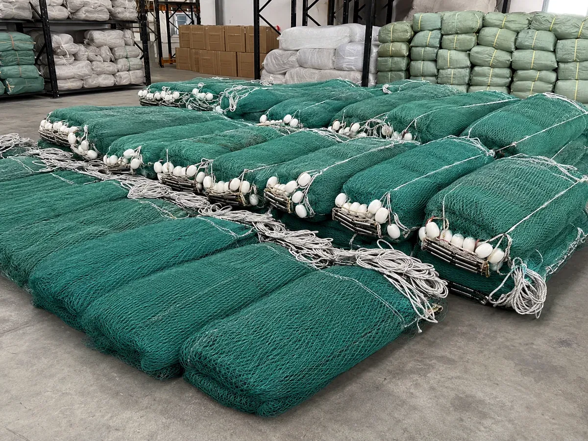 Finished fishing nets with floats ropes and packed bundles in warehouse