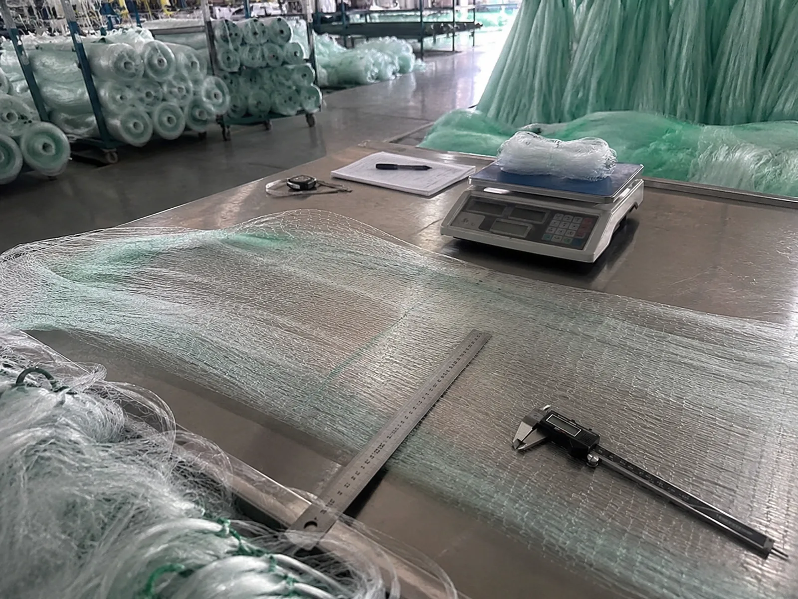 Fishing net panel mesh inspection with ruler caliper and scale